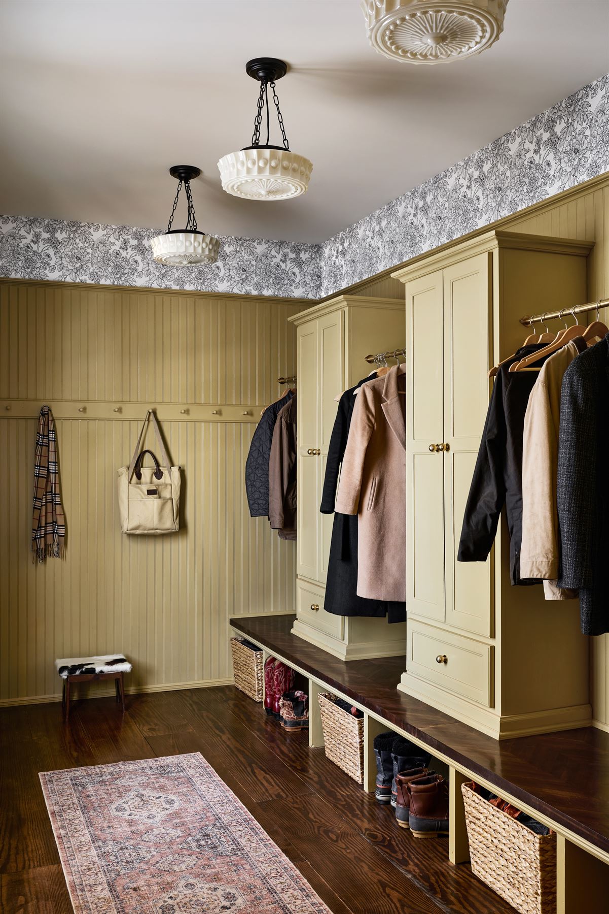 Mudroom with built-in lockers, bench and beadboard walls